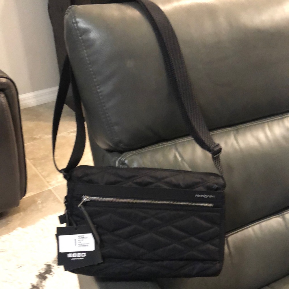 Black Messenger Bag with Adjustable Strap and Quilted Design